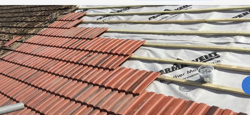 Full re-roofing project — new tiles being installed by Safeshield